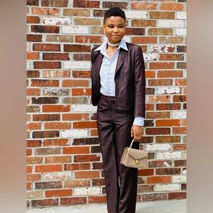 It’s a Manganese Brown suit, good quality, two pieces